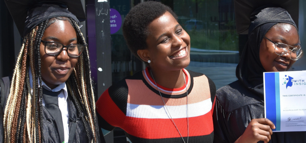 Three Black WIE mentees holding their Elevate certificates.