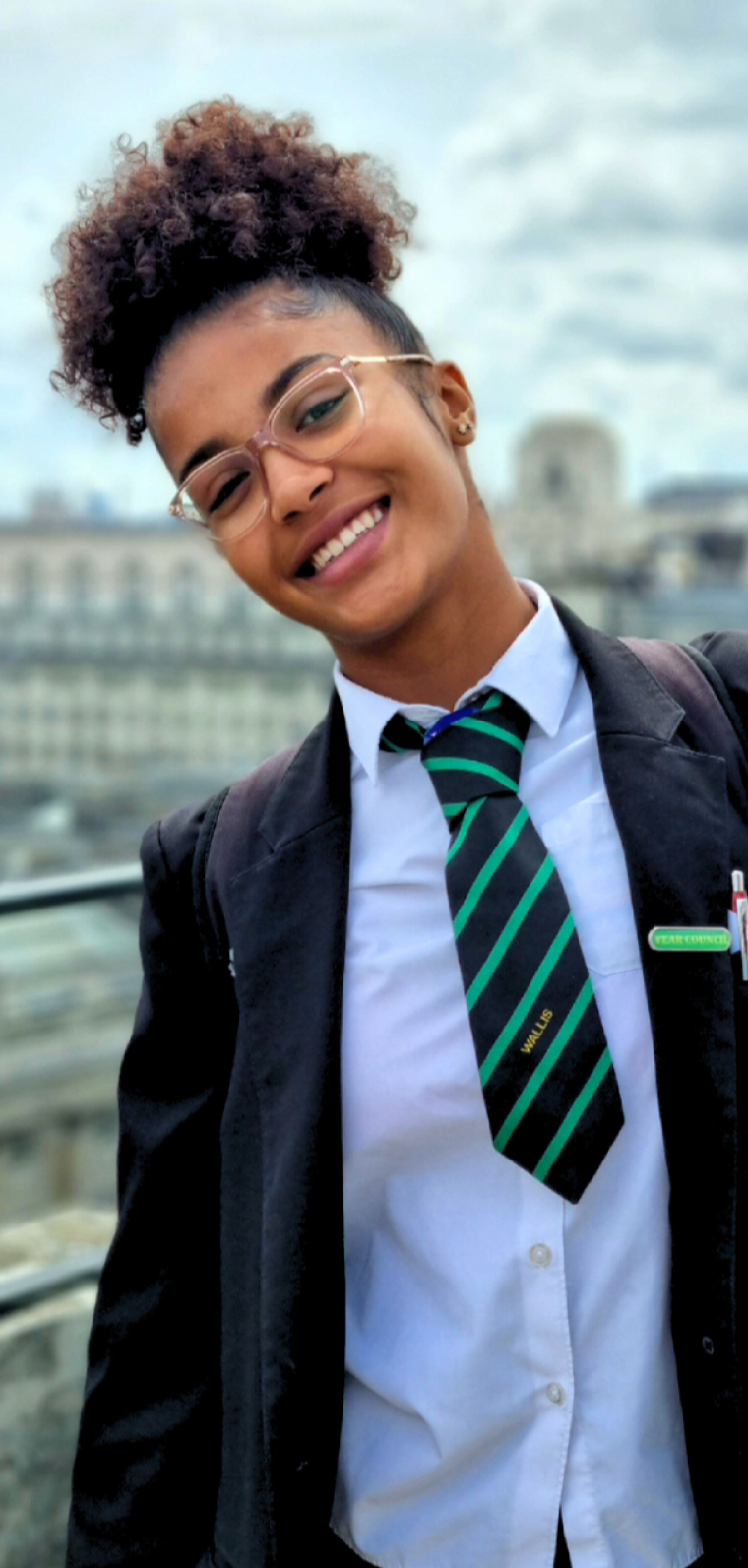 A Black female WIE Mentee wearing eyeglasses